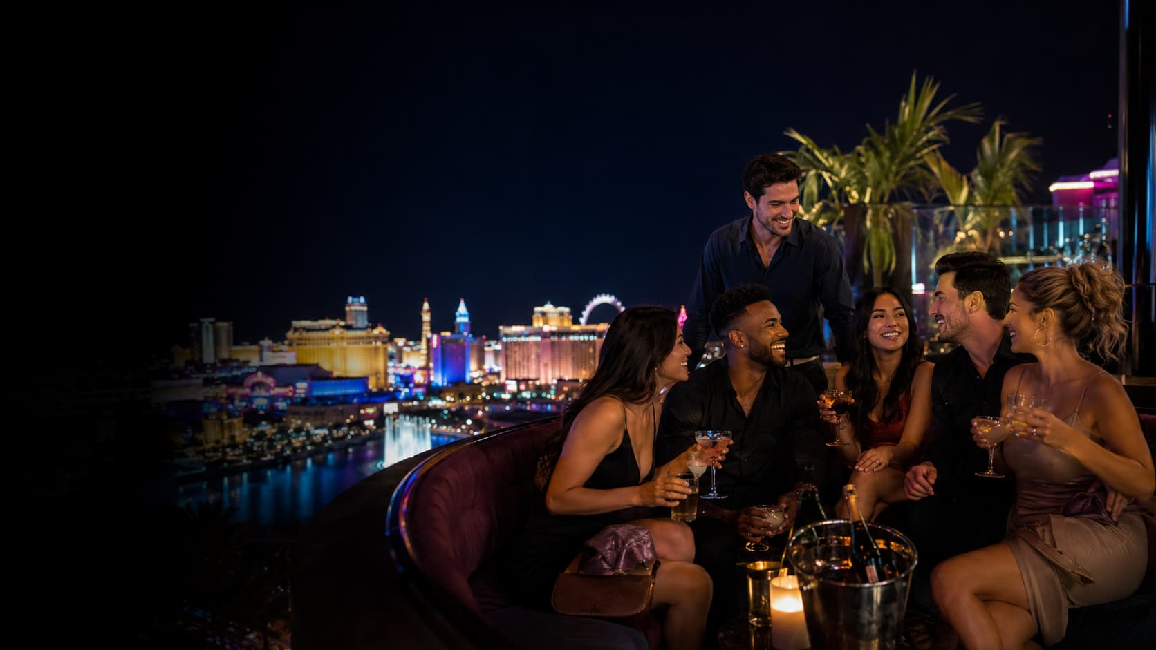 Group enjoying Las Vegas nightlife options for groups with Strip views